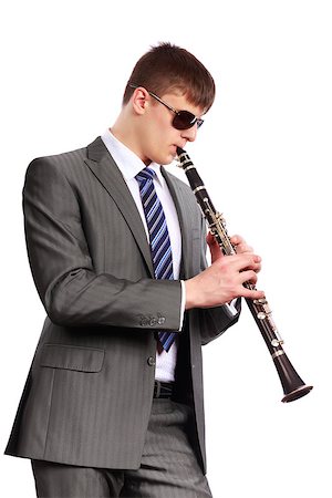 simsearch:400-04059260,k - Young musician with sunglasses playing the clarinet on a white background Stockbilder - Microstock & Abonnement, Bildnummer: 400-06558032