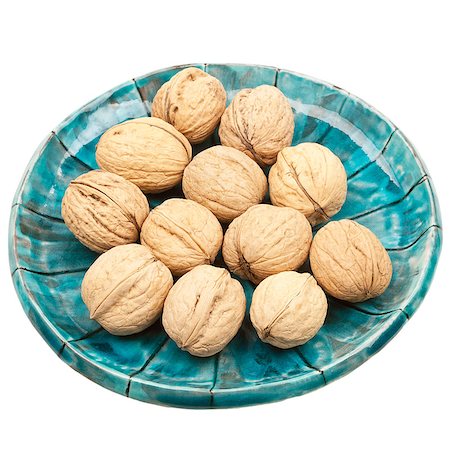 simsearch:400-06520688,k - Plate of walnuts isolated on white background Stock Photo - Budget Royalty-Free & Subscription, Code: 400-06558047