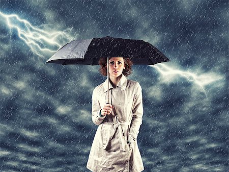 Photo of the girl with umbrella in a hand Stock Photo - Budget Royalty-Free & Subscription, Code: 400-06558088