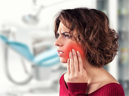 simsearch:400-06108956,k - Girl with a painful tooth in a medical office Fotografie stock - Microstock e Abbonamento, Codice: 400-06558090