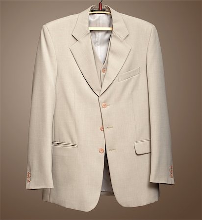 Beige jacket on hanger. Clipping path included. Stock Photo - Budget Royalty-Free & Subscription, Code: 400-06558266