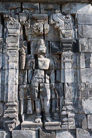 simsearch:400-06558274,k - Images of damaged Boddhisattva on stone wall of Perwara (guardian) temple in Candi Sewu complex (means 1000 temples). It has 253 building structures (8th Century) and it is the second largest Buddhist temple in Java, Indonesia. Photographie de stock - Aubaine LD & Abonnement, Code: 400-06558286