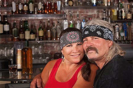 simsearch:400-06558607,k - Cute motorcycle gang husband and wife together in bar Stock Photo - Budget Royalty-Free & Subscription, Code: 400-06558624