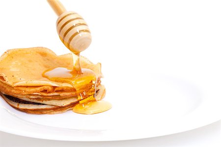 simsearch:400-04852542,k - Delicious Freshly Prepared Pancakes with Honey on white Stockbilder - Microstock & Abonnement, Bildnummer: 400-06558791