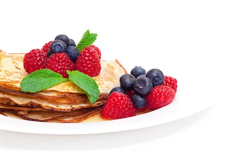 simsearch:400-04852542,k - Delicious Freshly Prepared Pancakes with Honey and Berries on white background Stockbilder - Microstock & Abonnement, Bildnummer: 400-06558793