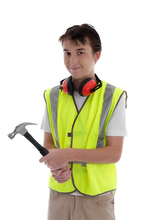 students working with tools - Teenager holding a hammer and smiling.  White background. Stock Photo - Budget Royalty-Free & Subscription, Code: 400-06558954