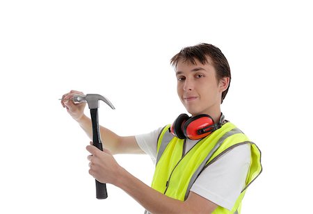 students working with tools - Teenage apprentice carpenter, builder construction worker using a hammer and nail and looking towards viewer.  White background. Stock Photo - Budget Royalty-Free & Subscription, Code: 400-06558957