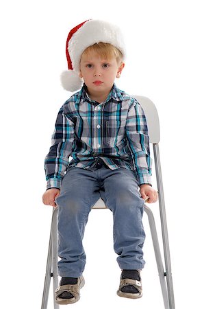 rosy cheeks - Little Boy with Santa Hat Sitting on Chair and Asking "I'm not Santa?" Stock Photo - Budget Royalty-Free & Subscription, Code: 400-06559318