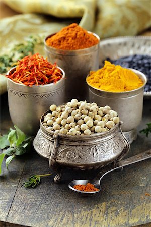 various spices (turmeric, paprika, saffron, coriander) in metal bowls Stock Photo - Budget Royalty-Free & Subscription, Code: 400-06559340