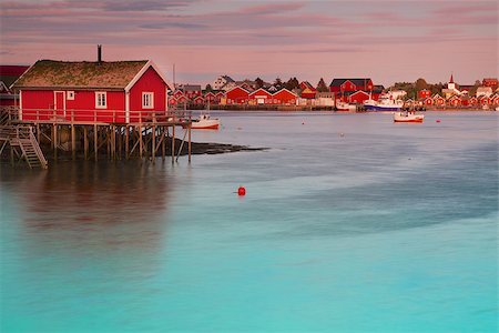 Typical red rorbu hut with sod roof in town of Reine on Lofoten islands in Norway Foto de stock - Super Valor sin royalties y Suscripción, Código: 400-06559700