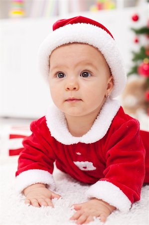 simsearch:400-07329323,k - Curious baby girl in christmas outfit - closeup Foto de stock - Royalty-Free Super Valor e Assinatura, Número: 400-06553899