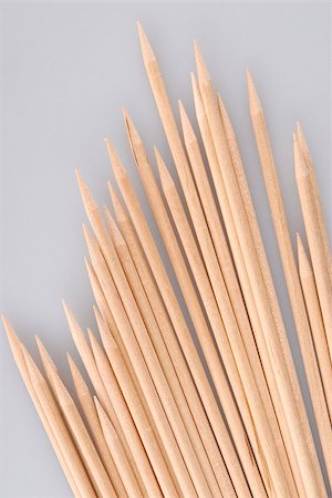 Multiple wooden bamboo skewers laying on a light background Stock Photo - Budget Royalty-Free & Subscription, Code: 400-06564290