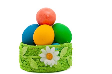 Easter eggs in the green basket isolated on white Photographie de stock - Aubaine LD & Abonnement, Code: 400-06564572