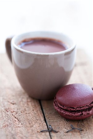 simsearch:400-08338397,k - Closeup of cup of hot chocolate and macaroon on a wooden table Photographie de stock - Aubaine LD & Abonnement, Code: 400-06565001