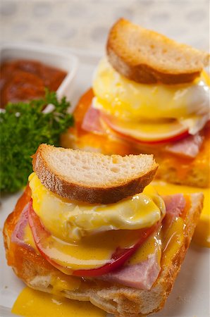 simsearch:400-07510513,k - fresh eggs benedict on bread with tomato and ham Stock Photo - Budget Royalty-Free & Subscription, Code: 400-06565348