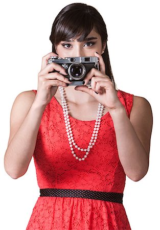 simsearch:400-04227852,k - Pretty Mexican woman over white background taking pictures Stockbilder - Microstock & Abonnement, Bildnummer: 400-06565454