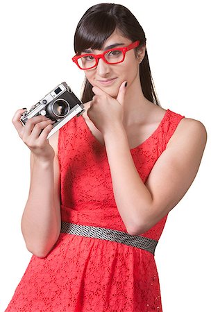 simsearch:400-07042108,k - Pensive woman with red eyeglasses and camera Stock Photo - Budget Royalty-Free & Subscription, Code: 400-06565451