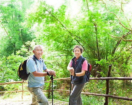 people with forest background - senior couple hiking in the nature with bamboo background Stock Photo - Budget Royalty-Free & Subscription, Code: 400-06565498
