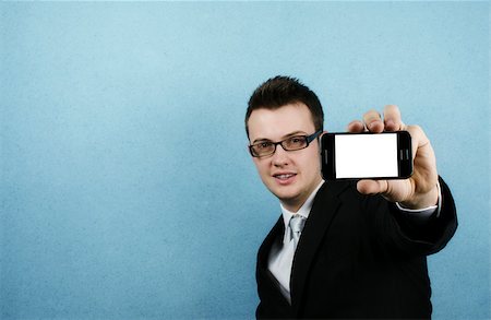 silent47 (artist) - Man holding out a phone with a blank screen Foto de stock - Super Valor sin royalties y Suscripción, Código: 400-06565729