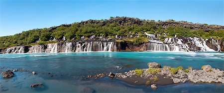 simsearch:400-04923181,k - Hraunfossar is a very beautiful Icelandic waterfall in the west of the island. It comes from the lava field and pours into the Hvita river with a incredibly blue water. Long exposure. Photographie de stock - Aubaine LD & Abonnement, Code: 400-06565805