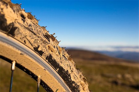 photojope (artist) - Closeup of a muddy bicycle wheel and tire in countryside. Fotografie stock - Microstock e Abbonamento, Codice: 400-06565814