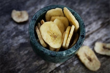 Healthy eating. Dried banana fruit on wooden background Stock Photo - Budget Royalty-Free & Subscription, Code: 400-06566030