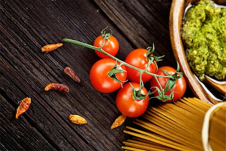 Italian cooking with whole wheat pasta, pesto sauce and ingredients Stock Photo - Budget Royalty-Free & Subscription, Code: 400-06566044