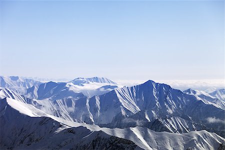 simsearch:400-06204301,k - Snowy mountains in haze. Caucasus Mountains, Georgia, view from ski resort Gudauri. Stock Photo - Budget Royalty-Free & Subscription, Code: 400-06566239