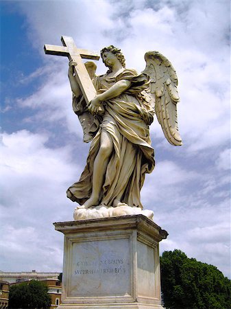 This statue of an angel clutching the cross stands among many along the bridge leading to the Castel Sant'Angelo. Stock Photo - Budget Royalty-Free & Subscription, Code: 400-06566582