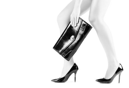 simsearch:400-07099649,k - Beautiful slender womanish feet in black shoes and mini bag Foto de stock - Super Valor sin royalties y Suscripción, Código: 400-06566833
