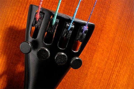 Violin tailpiece with fine tuners and strings closeup Stock Photo - Budget Royalty-Free & Subscription, Code: 400-06566854