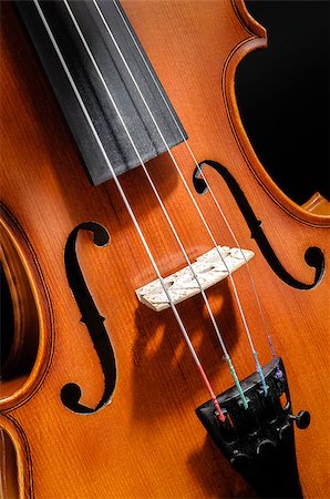 Violin front view on black background cropped closeup Stock Photo - Budget Royalty-Free & Subscription, Code: 400-06566855