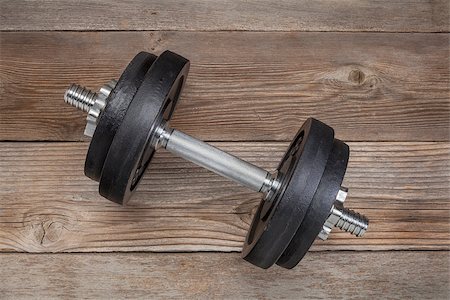 simsearch:400-07620929,k - exercise weights - iron dumbbell on a wooden deck Stock Photo - Budget Royalty-Free & Subscription, Code: 400-06566860