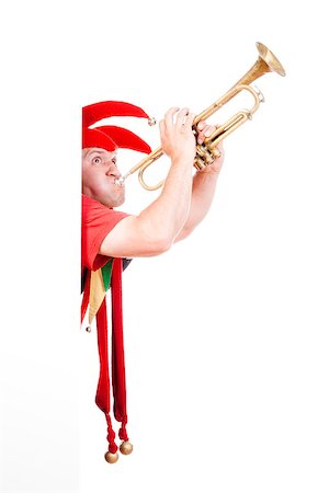 jester - entertaining figure in typical costume blowing trumpet Stock Photo - Budget Royalty-Free & Subscription, Code: 400-06566881