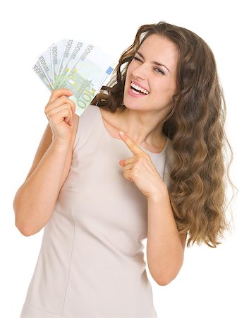 Smiling young woman pointing on euros Stock Photo - Budget Royalty-Free & Subscription, Code: 400-06567067