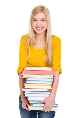 school girl holding pile of books - Happy student girl holding pile of books Stock Photo - Budget Royalty-Free & Subscription, Code: 400-06567076