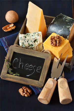 Various types of cheese composition and walnuts with vintage chalk blackboard tag. Stock Photo - Budget Royalty-Free & Subscription, Code: 400-06567257