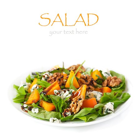 Delicious salad. Fresh arugula, persimmon, blue cheese and walnuts with balsamic vinegar. Stock Photo - Budget Royalty-Free & Subscription, Code: 400-06567251