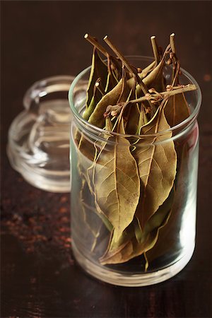 simsearch:400-07578178,k - Spicy laurel bay leaves in a glass pot on a dark wooden background. Stock Photo - Budget Royalty-Free & Subscription, Code: 400-06567265