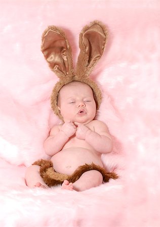 baby girl dressed up like easter bunny on pink background Stock Photo - Budget Royalty-Free & Subscription, Code: 400-06567303