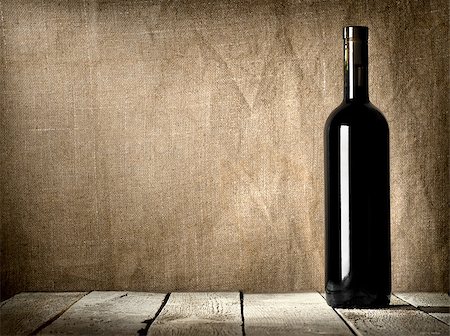Black bottle of wine on the background of the canvas Stock Photo - Budget Royalty-Free & Subscription, Code: 400-06567388