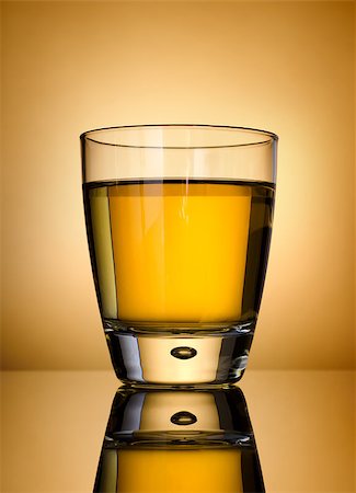 Glass of whisky on a gold background Stock Photo - Budget Royalty-Free & Subscription, Code: 400-06567468