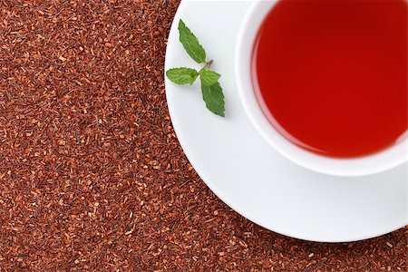 simsearch:400-06554630,k - Rooibos Tea in a cup with lots of copy space and a lemon balm leaf Stock Photo - Budget Royalty-Free & Subscription, Code: 400-06567526