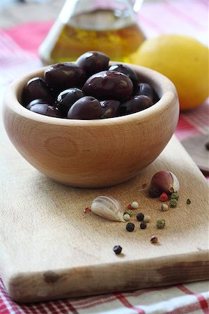 eating olive - Black olives in wooden bowl close up, shallow dof Stock Photo - Budget Royalty-Free & Subscription, Code: 400-06568131