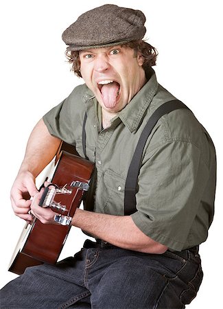 Young Caucasian Guitarist sticking out his tongue Stock Photo - Budget Royalty-Free & Subscription, Code: 400-06568381