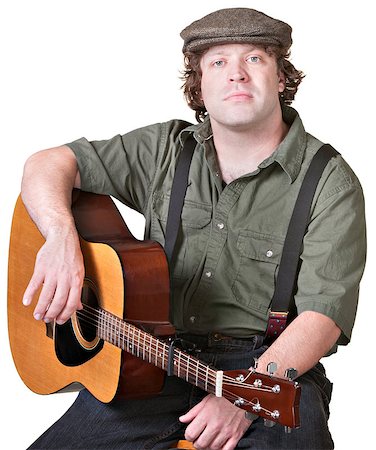 Calm musician holding his guitar over white background Stock Photo - Budget Royalty-Free & Subscription, Code: 400-06568382