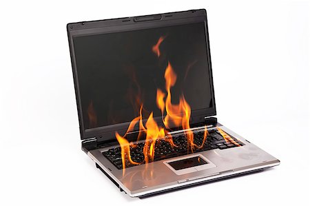 Laptop burning with fire on white background Stock Photo - Budget Royalty-Free & Subscription, Code: 400-06568689