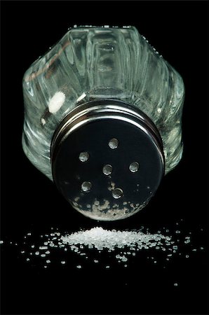 simsearch:400-08154994,k - Pile of spilled salt and saltshaker black isolated Stock Photo - Budget Royalty-Free & Subscription, Code: 400-06568704