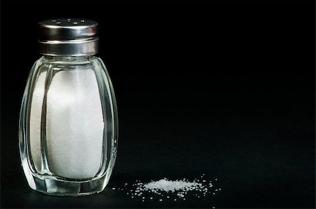 simsearch:400-08376668,k - Pile of spilled salt and saltshaker black isolated Stock Photo - Budget Royalty-Free & Subscription, Code: 400-06568705