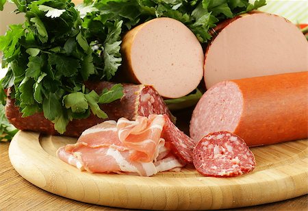 Assorted variety of sausages on a cutting board Stock Photo - Budget Royalty-Free & Subscription, Code: 400-06569942